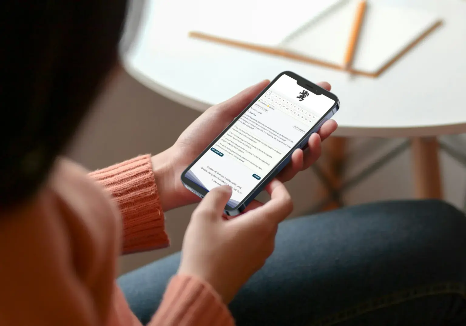 Candidate using Denken Exam on mobile
